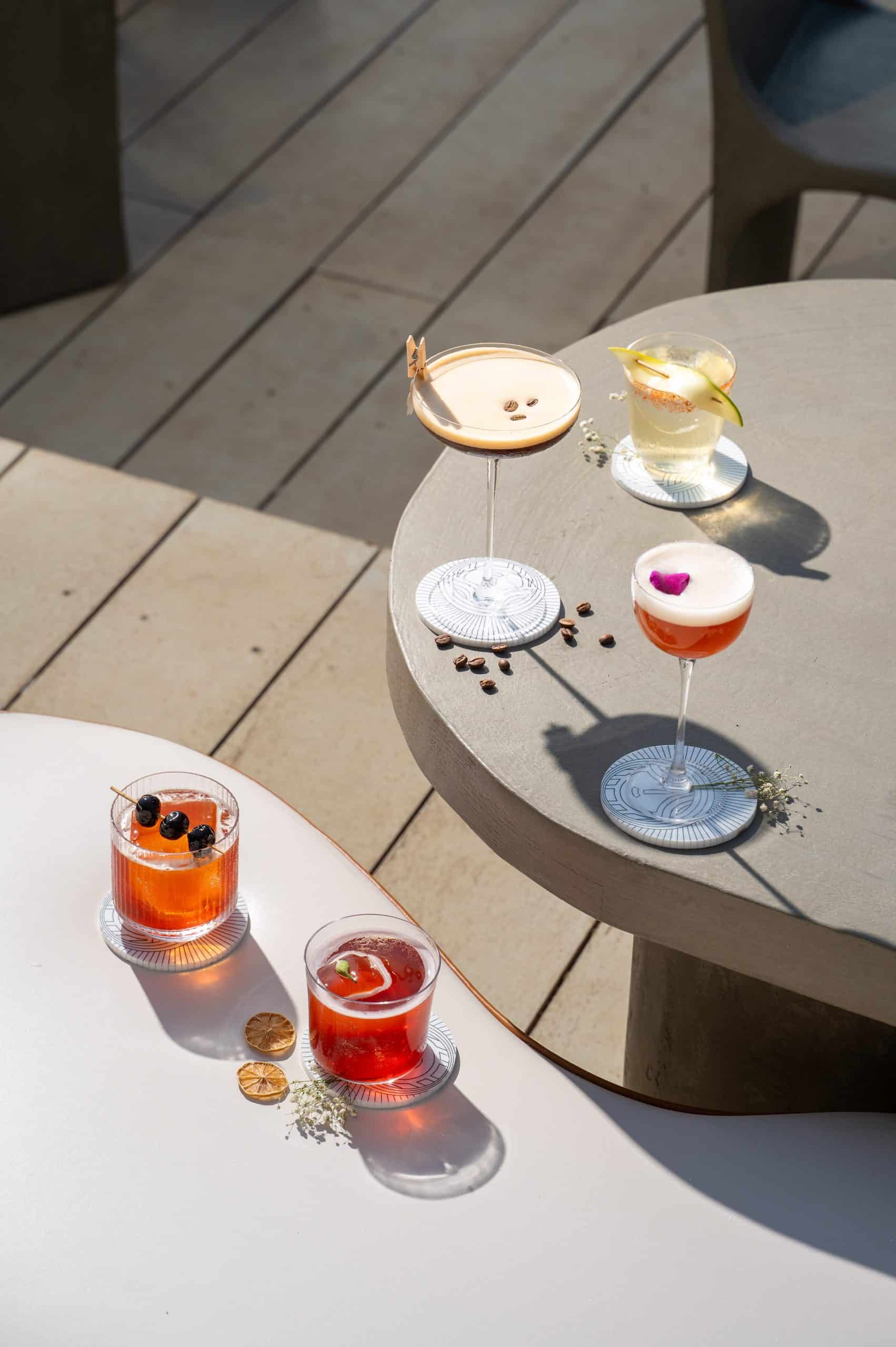 The café transitions into a sundowner spot with views of the beach at sunset