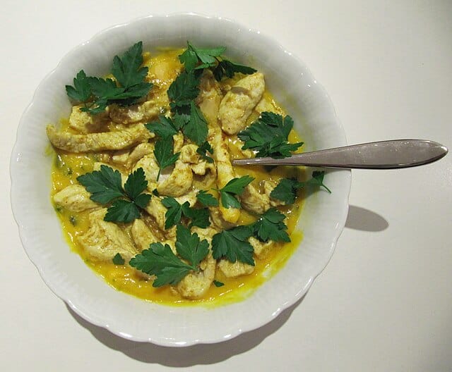 Mulligatawny soup stands as a remarkable example of culinary adaptation born from the intersection of British and Indian dining traditions Image courtesy Geo Trinity via Wikkimedia commons