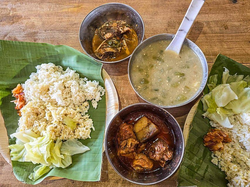 A local cuisine of Nagaland served with pork curry and local river fish curry. Courtesy: Wikimedia