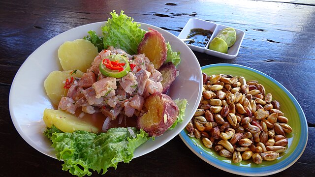 Ceviche is a popular cuisine that consists of raw fish marinated in fresh citrus juice (usually lime or lemon) and seasoned with local spices such as onions, chile peppers, and salt. Image Courtesy: Waterloo1883, Wikimedia