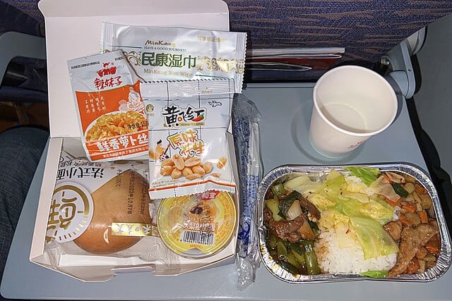 A combo rice with twice-cooked beef and kung pao chicken made at a sky kitchen. Courtesy: N509FZ, wikimedia