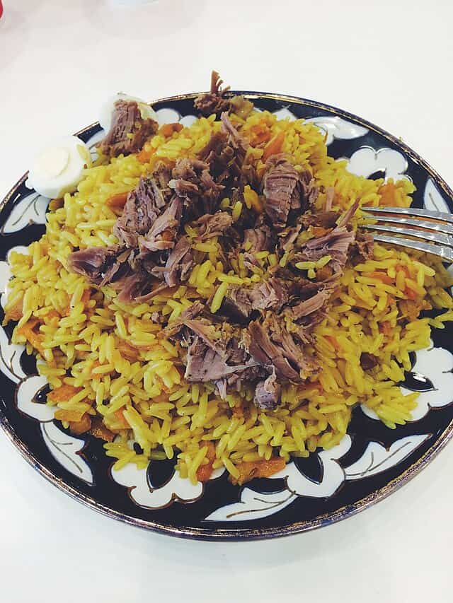 Oshi palav, often known as pilaf, is a well-known traditional rice dish associated with Tajikistan and Central Asian culture in general. Image Courtesy: GeoO, Wikimedia