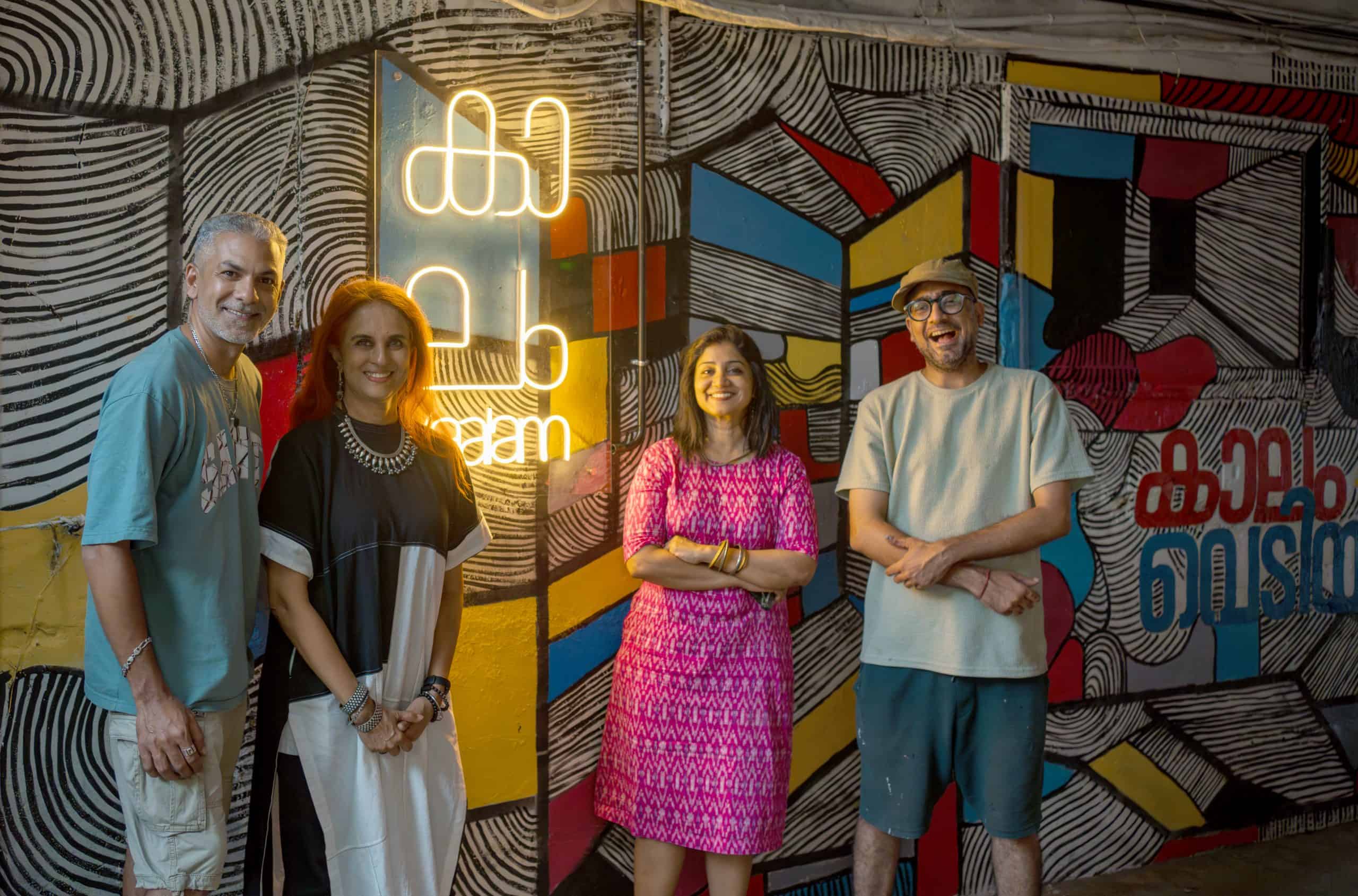 Neon text, suspended Malayalam letters, and spatial interventions shape Kaalam at Gallery OED Courtyard, Kochi.
